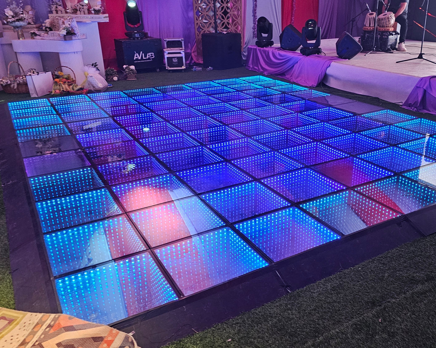 LED dance floor with colorful lighting at an event venue.